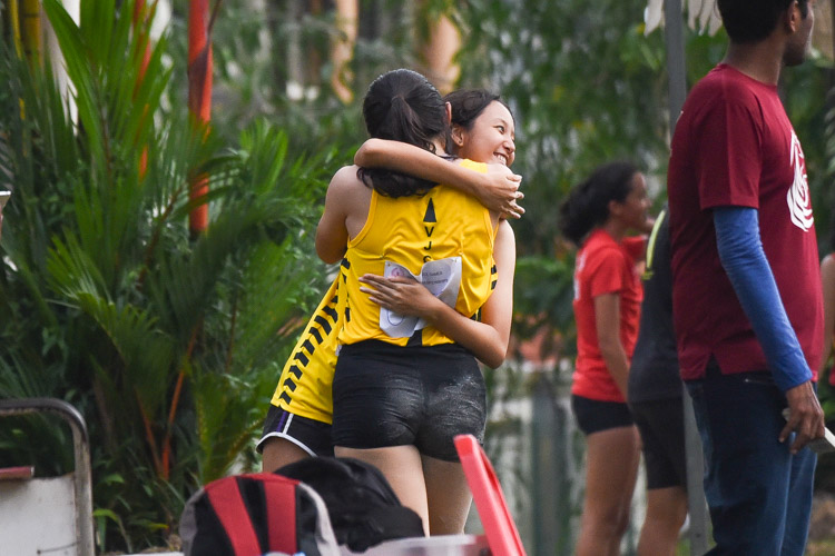 Hannah Loo of VJC celebrating with teammate Yin Yichen after leaping 11.05m on her last try to snatch the lead in the A Division girls' triple jump. However, HCI's Tan Tse Teng jumped 11.25m right after, to make Hannah settle for the silver. (Photo 7 © Iman Hashim/Red Sports)