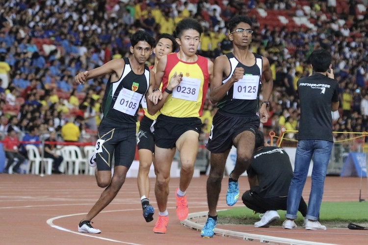 Armand Dhilawala Mohan of Raffles Institution attempts running ahead of Ethan Yikai of Hwa Chong Institution.
