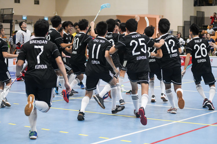 EJC celebrate at the end of the match after holding off a late VJC challenge to win 4-3 and secure the title. (Photo 1 © Iman Hashim/Red Sports)