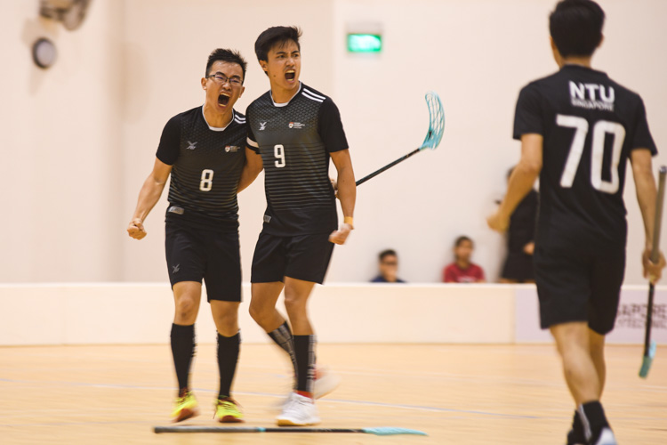 Amshar bin Amin (NTU #9) celebrating one of his goals with his teammate, Sean Toh (NTU #8). NTU put on an offensive exhibition as they demolished Team ITE, who were POL-ITE champions, with a 6-0 victory to clinch the IVP title. (Photo 1 © Stefanus Ian)