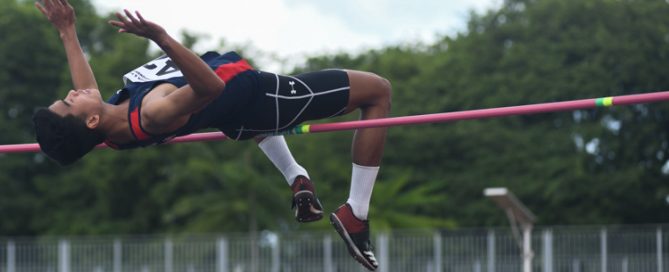 Hairul Syamil (#42, Nanyang Polytechnic) completed his hat-trick of IVP high jump title with a final jump of 1.96m.(Photo 1 © Stefanus Ian/Red Sports)