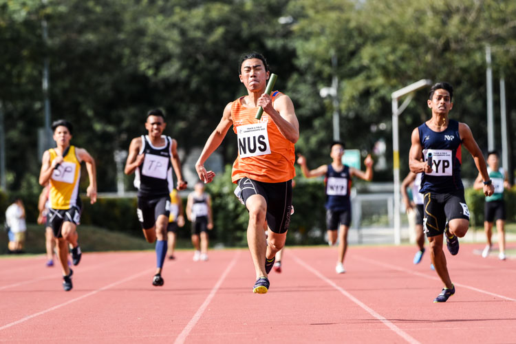 Mitchell Teh (in orange) anchors the National University of Singapore (NUS) quartet to the Men's 4x100m Relay gold, stopping the clock at 43.05 seconds. (Photo 1 © Iman Hashim/Red Sports)