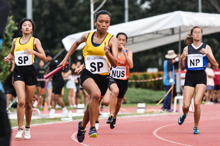 Celine Goe of Singapore Polytechnic (in yellow) starts her third leg in the Women's 4x100m Relay final. (Photo 1 © Iman Hashim/Red Sports)
