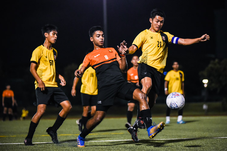Sheares Hall's Shamir Robinson (#8) tussles with Eusoff Hall's Marcus Leow (#21) for the ball. Shamir scored the second goal as Sheares beat Eusoff 2-0 in the NUS IHG men's football final to clinch their third title in four years. (Photo 1 © Iman Hashim/Red Sports)