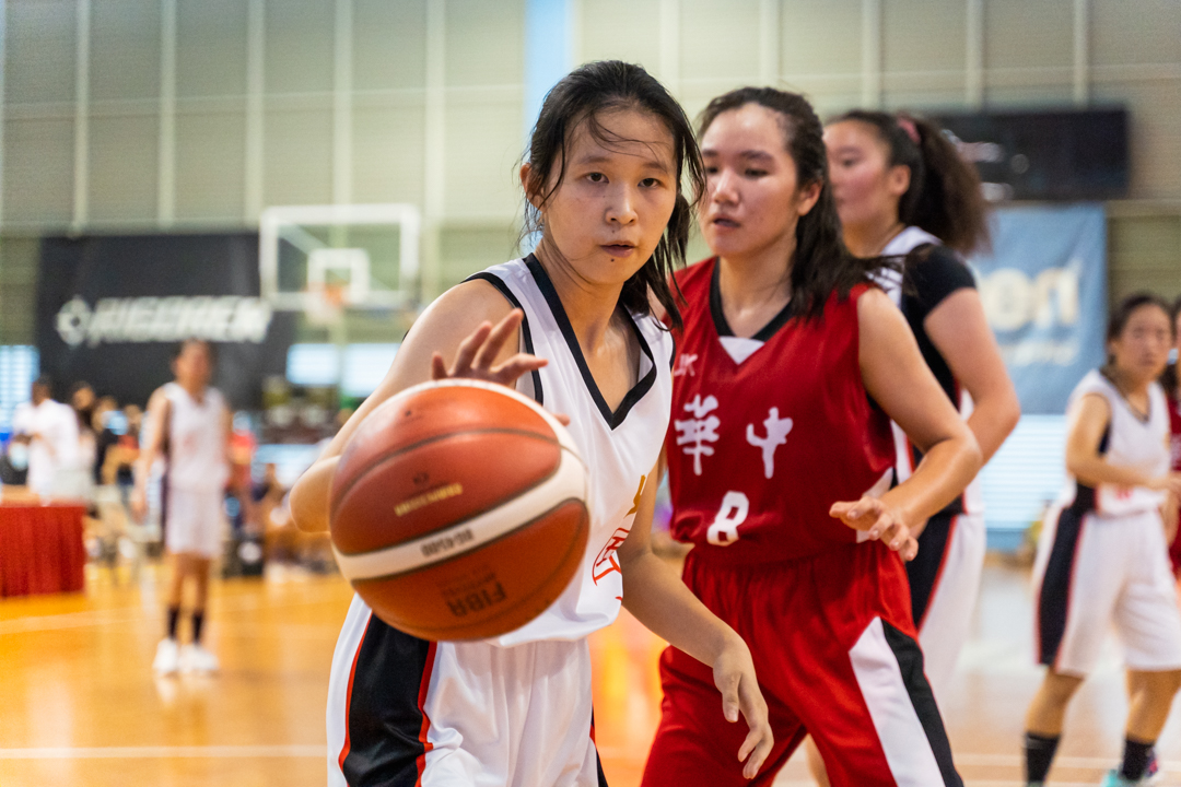 NJC player (left, in white) receives a pass. (Photo X © Bryan Foo/Red Sports)