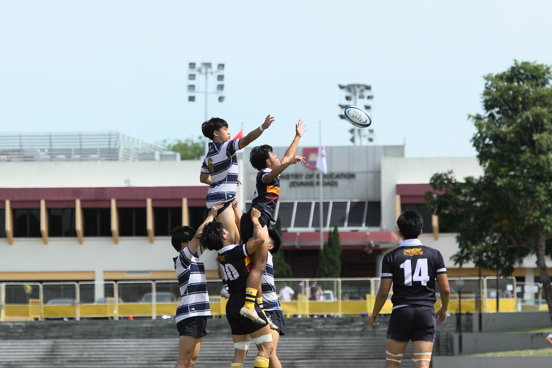 SAJC's Jeremy Tan Jia Le (#6) and ACJC's Ryan Erwin Bin Abdul Halim (#15) are lifted into the air to compete at the lineout.