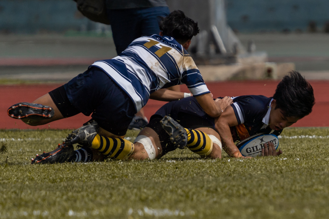 ACJC's Danyl Tan Ray Gene (#30) scores the first try of the match.
