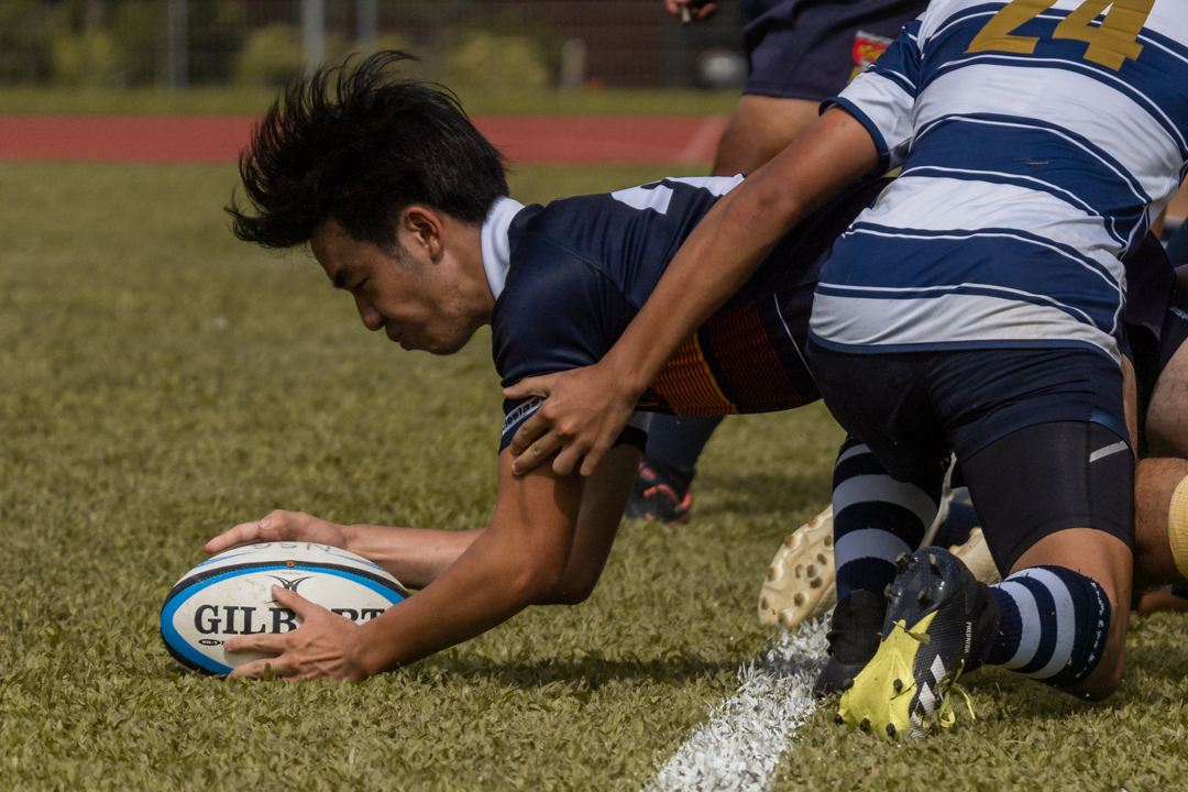 Lee Ji Quan (#21) picks and goes at the ruck to score for ACJC.
