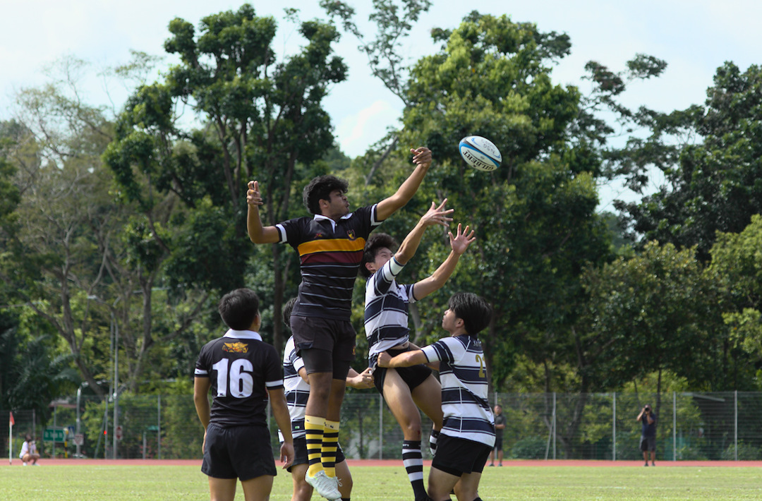 ACJC's Muhammad Waseem Akram Amanullah (#18) wins the ball back for ACJC at the lineout.
