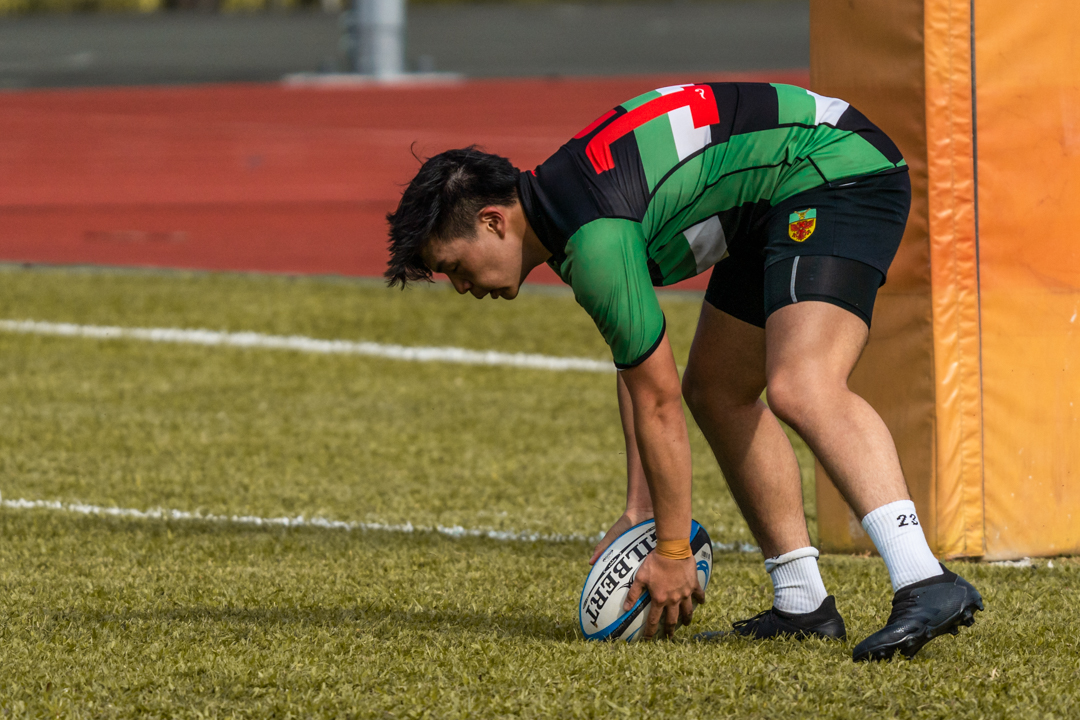 Jerome Wee grounds the ball to score a try for Raffles. (Photo 28 © Bryan Foo/Red Sports)