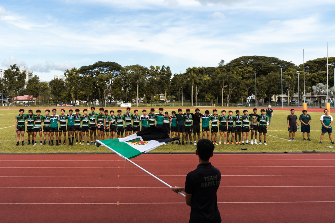 Raffles Institution players sing their school anthem together with their supporters after the final. (Photo 36 © Bryan Foo/Red Sports)