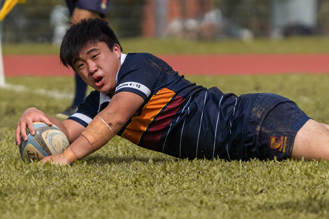 ACJC's Jaylen Ang scores a try. (Photo 2 © Bryan Foo/Red Sports)