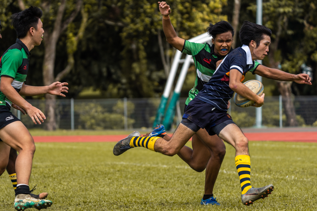ACJC player Aiden Khoo makes a line break to score a try. (Photo 3 © Bryan Foo/Red Sports)