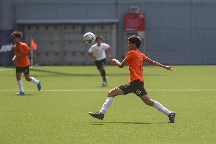 Ong E Jay (SAJC #18) sending the ball forward in an attempt to launch another SAJC attack