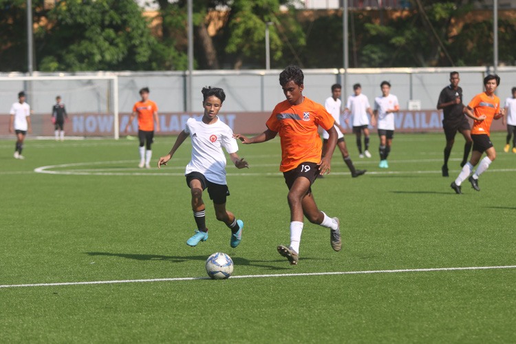 T Naveen (SAJC #19) attempts to bring the ball out from defense under pressure from Syaraf Ammar (VJC #17)