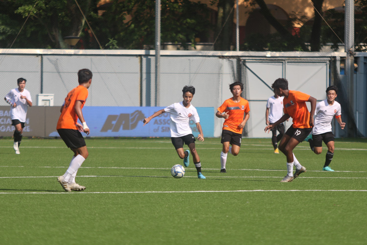 Substitute Syaraf Ammar (VJC #17) bringing the ball down through midfield