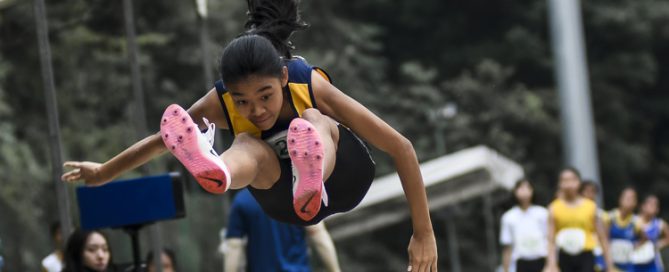 Chloe Chee (#245) of Methodist Girls' School clinched the C Division girls' long jump gold with a leap of 5.12m, just 7cm shy of the championship record in the event. (Photo 1 © Iman Hashim/Red Sports)