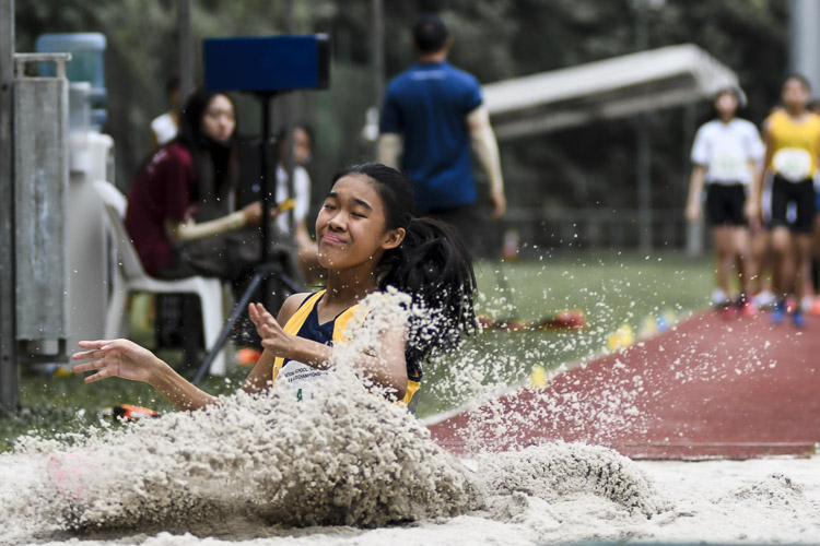 Chloe Chee (#245) of Methodist Girls' School clinched the C Division girls' long jump gold with a leap of 5.12m, just 7cm shy of the championship record in the event. (Photo 1 © Iman Hashim/Red Sports)
