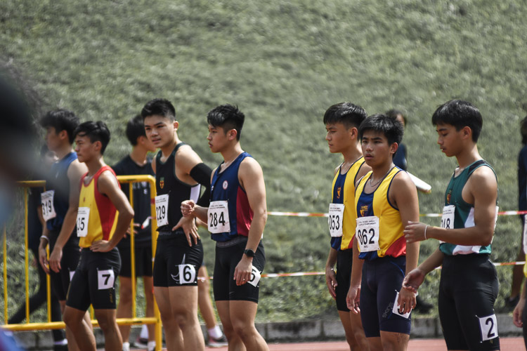 Finalists of the A Div boys' 100m toe the start line ahead of the race. (Photo 1 © Iman Hashim/Red Sports)