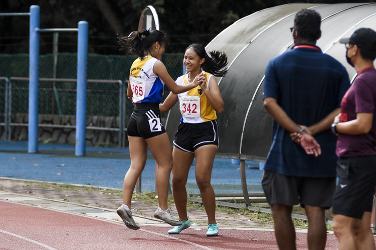 Runners from Nanyang Girls' High embrace after the B Div girls' 4x100m relay final. They placed fourth. (Photo 1 © Iman Hashim/Red Sports)
