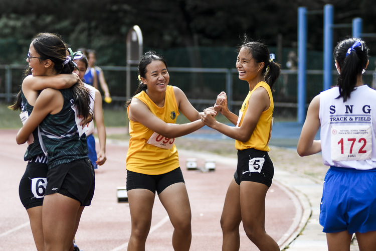 Runners from Cedar and RGS rejoice after the B Div girls' 4x100m relay final. (Photo 1 © Iman Hashim/Red Sports)
