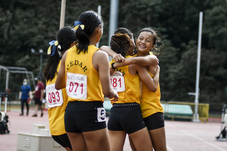 Cedar's Megan Ying, champion in the long jump and silver medalist in the 100m, celebrate with her teammates after winning the B Div girls' 4x100m relay final. (Photo 1 © Iman Hashim/Red Sports)