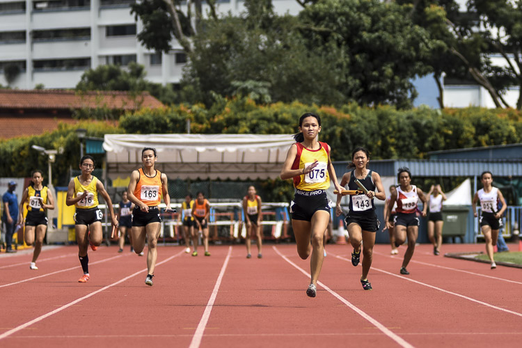 Alexia Song (#75) anchors HCI to gold in the A Div girls' 4x100m relay final. (Photo 1 © Iman Hashim/Red Sports)