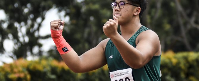 RI's Aloysius Loh (#232) celebrates after setting a new championship record of 17.89m in the A Division boys' shot put (5kg). (Photo 1 © Iman Hashim/Red Sports)
