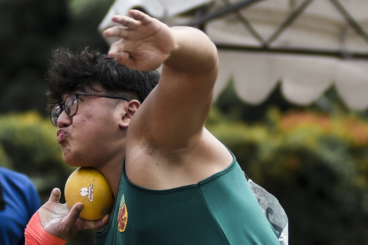 RI's Aloysius Loh (#232) comes in clutch, recording a distance of 17.89m on his last throw -- and the last piece of action at the meet -- to eclipse the A Division boys' shot put (5kg) championship record. (Photo 1 © Iman Hashim/Red Sports)