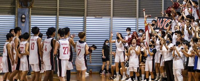 NJC celebrate with their schoolmates and supporters after sealing their school's first ever A Division boys' basketball title. (Photo 1 © Iman Hashim/Red Sports)