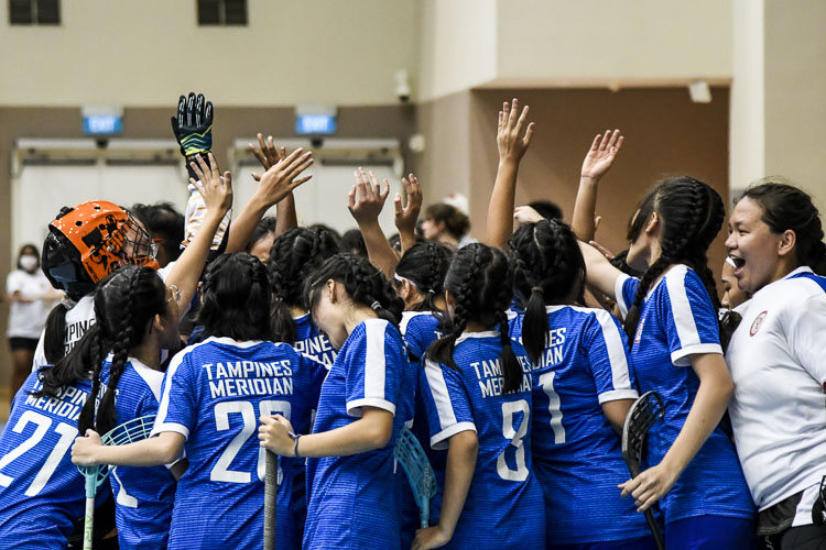 TMJC players do a group cheer at the end of a time-out during the final period. (Photo 1 © Iman Hashim/Red Sports)