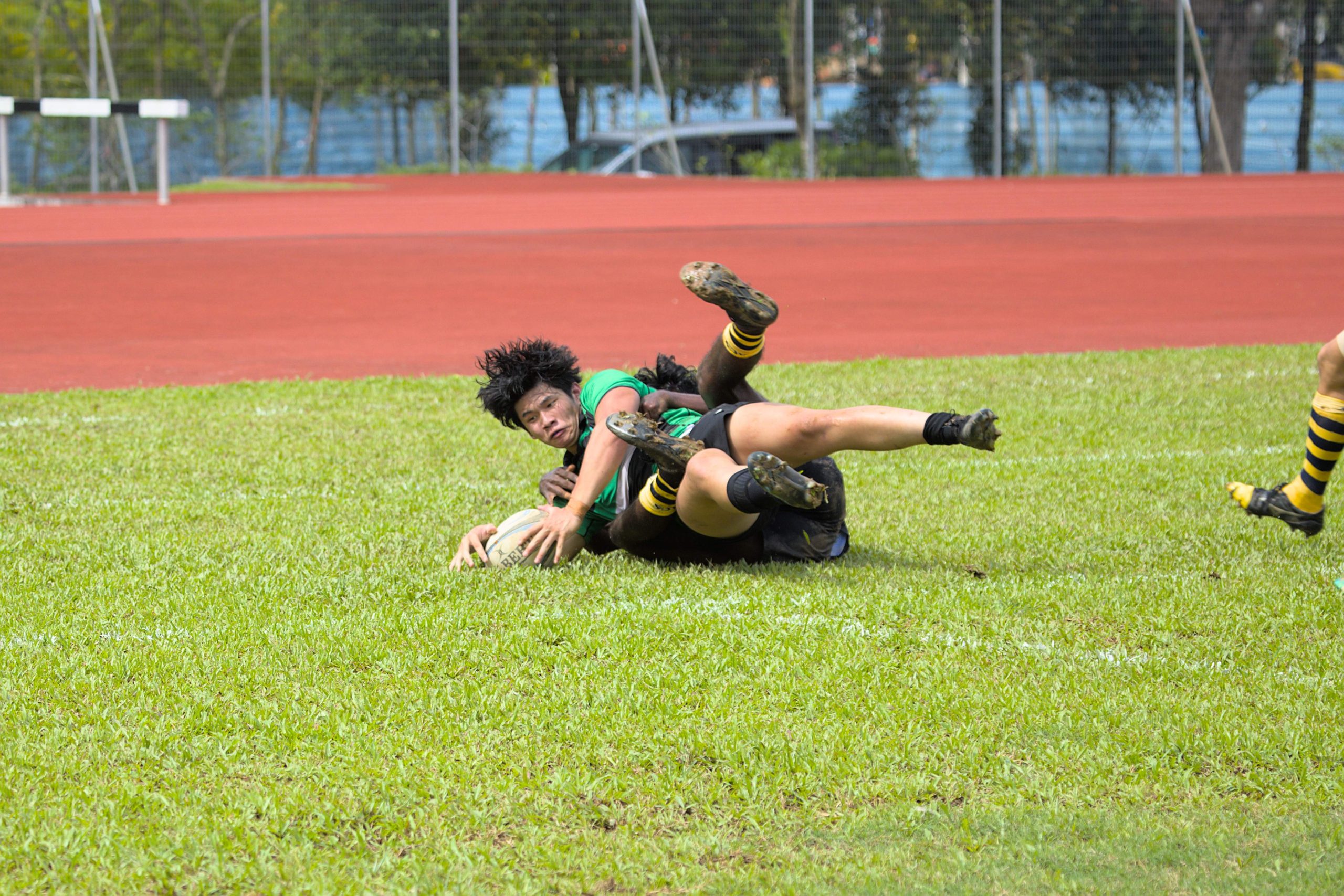 RI's Tyler Leong fought through a covering tackle by ACJC's Ramanathan Annamalai to score the second half's only try.