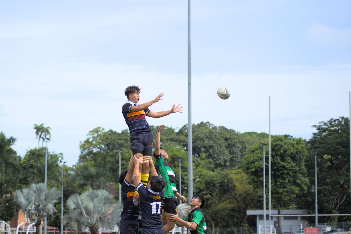 ACJC's Kieran Issac Kho is lifted into the air for a lineout during the second game.