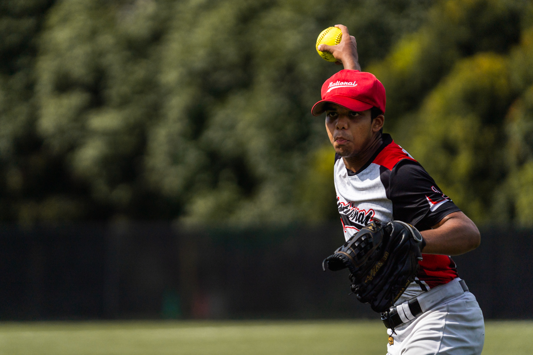Aniket (NJC #1) winds his arm up for the pitch. (Photo X © Bryan Foo/Red Sports)