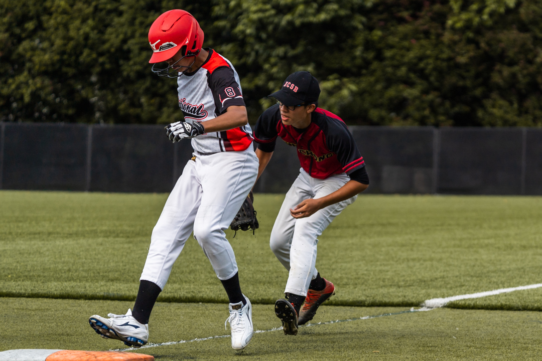 Voon Guo (NJC #8) (left) takes second base. (Photo X © Bryan Foo/Red Sports)