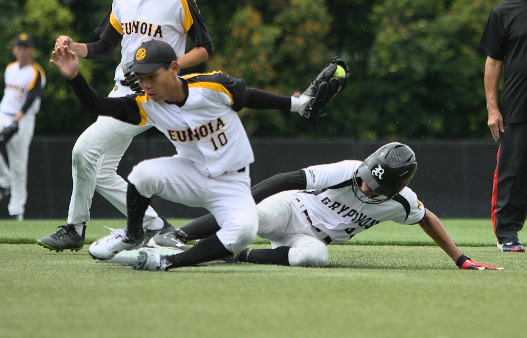 RI's Nayan (#25) slides into 2nd a split-second before EJ's Jotham Yeo (#10) can touch it.