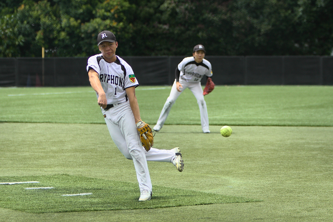 Raffles captain Shawn Yip pitches in the final inning of the game.
