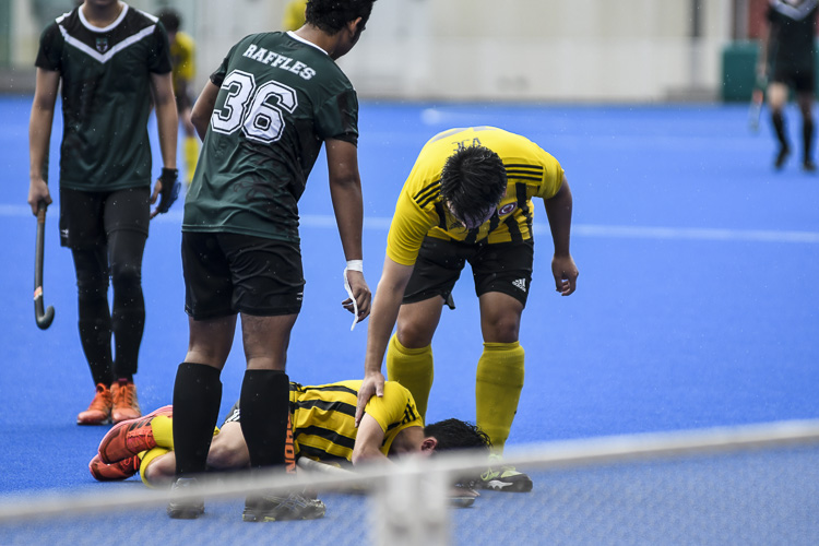 Dillon Lee (VJC #10) goes down and is checked upon by a teammate. (Photo 1 © Iman Hashim/Red Sports)