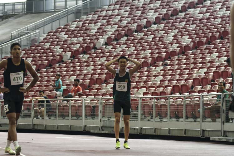 RI's Wang Qiyue (#390) reacts after winning the C Div boys' 100m final. (Photo 1 © Iman Hashim/Red Sports)