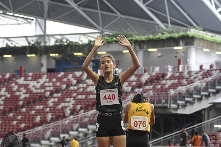 Clara Lim (#440) of RGS reacts after winning the B Div girls' 100m final. (Photo 1 © Iman Hashim/Red Sports)