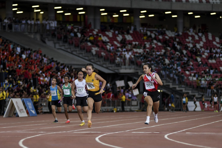 Heather Tan (#53) anchors Cedar Girls' to gold in the C Div girls' 4x100m relay final. National Junior College finished second, while Nanyang Girls' High were third. (Photo X © Iman Hashim/Red Sports)