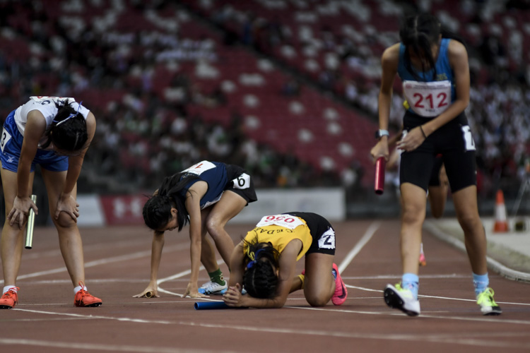 The aftermath of the B Div girls' 4x400m relay final.  (Photo 1 © Iman Hashim/Red Sports)