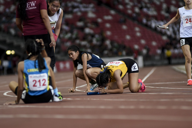 The aftermath of the B Div girls' 4x400m relay final.  (Photo 1 © Iman Hashim/Red Sports)