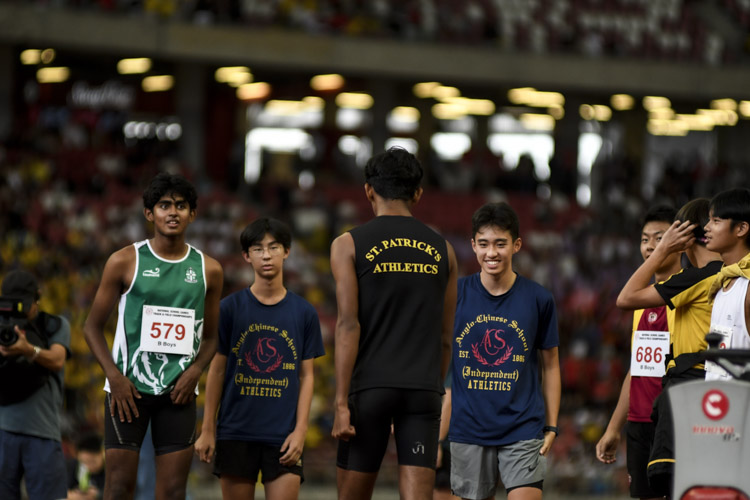 Competitors congratulate Viresh Kumar after a successful clearance in the B Div boys' high jump final. (Photo 1 © Iman Hashim/Red Sports)