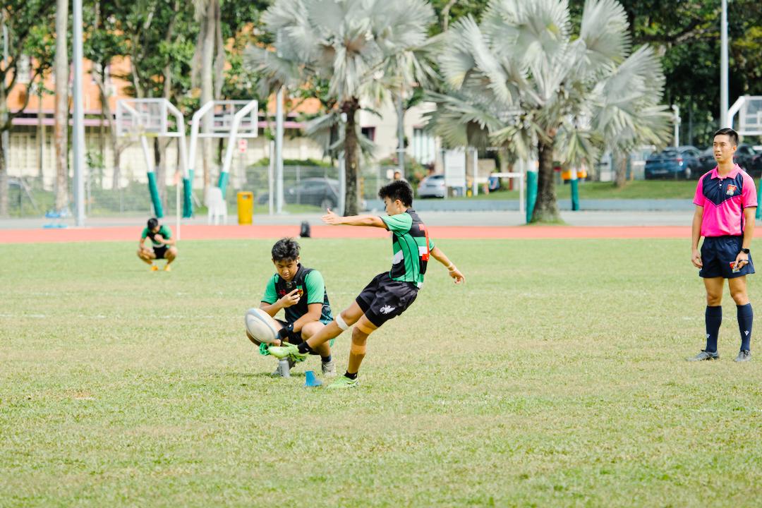Caleb Low (#18) connects with the ball. (Photo 14 © Shenn Tan/Red Sports)