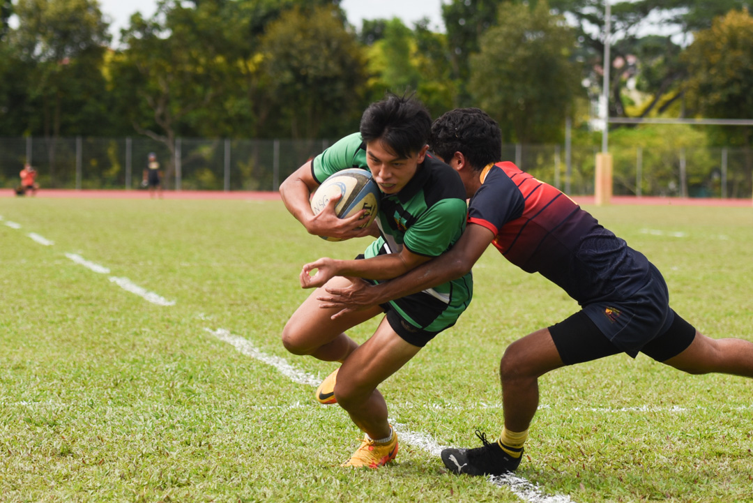 RI's Titus Lim (#23) on his way to score his team's 3rd try. (Photo 3 © Jared Chow/Red Sports)